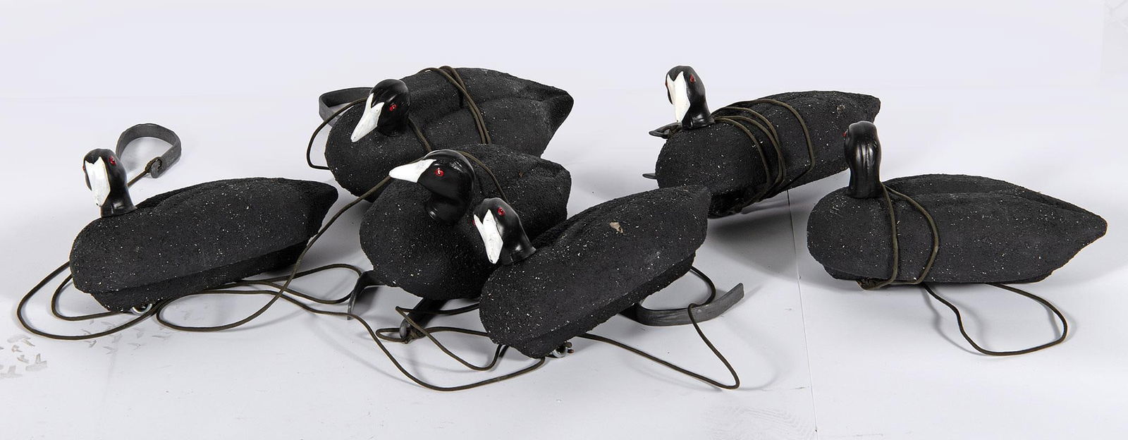 Grouping of Black Painted Plastic Duck Decoys: Grouping of 6 black painted plastic duck decoys; ht. 7, wd. 12, dp. 6 inches. Overall good condition. Minor wear.