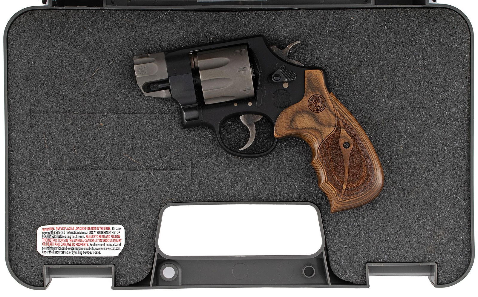 *Smith & Wesson Model 327 Revolver: .357 caliber, 2" barrel, S/N CYA4275. Matte blue finish with checkered walnut grips. In the original hard shell case. This revolver is in very good condition in box with the original manual and record