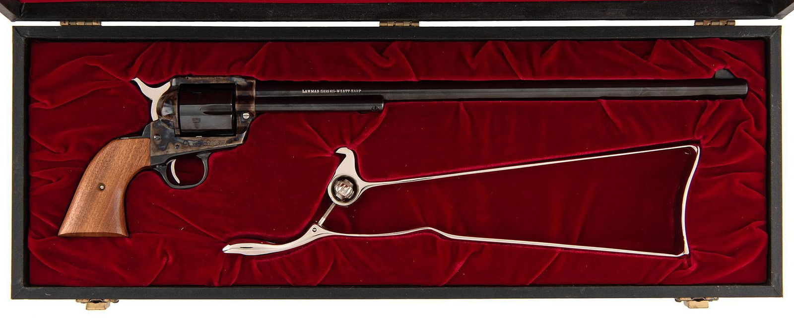 ** Colt SAA Buntline Lawman Series Wyatt Earp Revolver: .45 Long Colt caliber, 16" barrel, S/N 425WYE. Blue finish with a case harden finish frame. Two piece walnut grips. Fitted with a nickel plated shoulder stock. cased in a black leather and red lined c