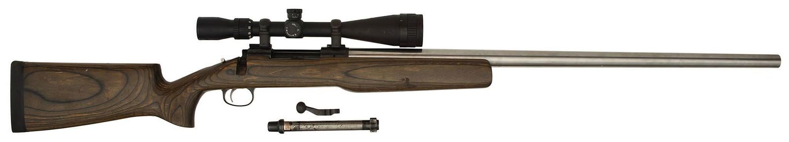 *Custom Remington Model 700 Bolt Action Rifle: 6.5 Gibbs, 29" barrel, S/N A6639022. Custom stainless Gibbs barrel marked BBS Gibbs. Wood pistol grip stock with rubber butt plate. Tasco 6-24 x 44 mounted scope. Overall good condition. Bolt present