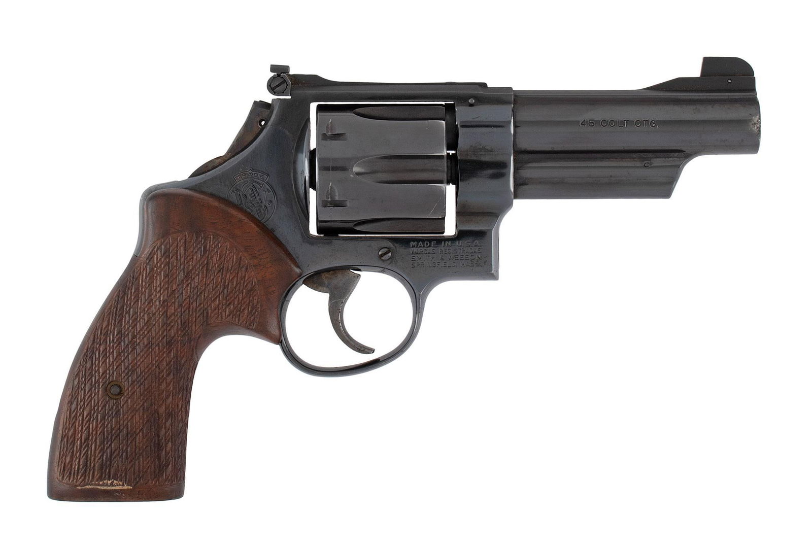 *Smith & Wesson Model 25-5: .45 colt caliber, 4" barrel, S/N N715450. Blue finish, custom checkered walnut grips, bobbed hammer, smooth trigger. Overall the revolver is excellent , a little wear around the muzzle from holster we