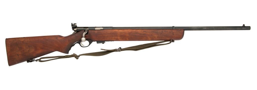 **U.S. Property Marked M44 Mossberg Rifle: .22 caliber, 26" barrel length, S/N 107460. Blue finish on the metal surfaces. "US" markings on top of the receiver. Polished bolt and walnut pistol grip stock. Front blade sight and rear target