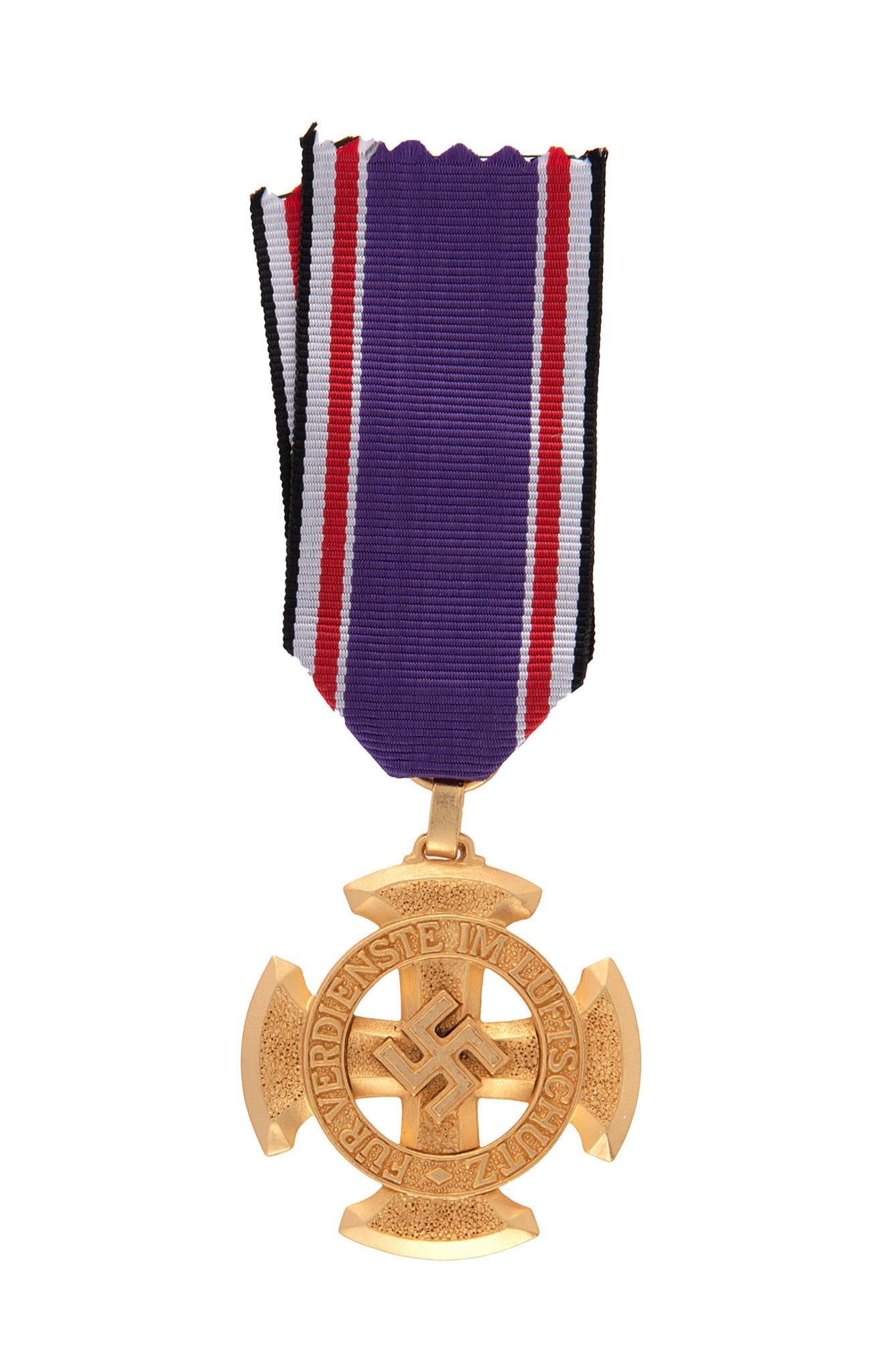 German WWII 1st Class Luftschutz RLB Decoration: Measures 1 9/16'' wide by 1 11/16'' tall. The front reads 'Fur Verdienste im Luftschutz'. There is a swastika in the center of the maltese cross. The reverse side is dated '1938'. Includes the present