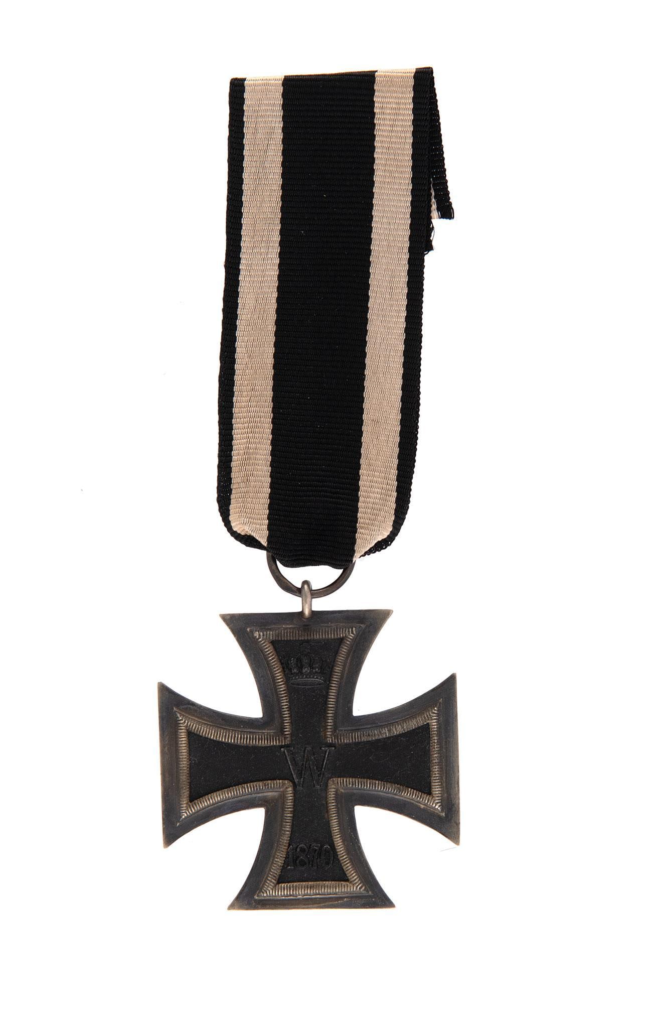 Imperial German Pre WW1 2nd Class 1870 Iron Cross Decoration: Lot includes Imperial German Pre WW1 2nd Class 1870 Iron Cross Decoration. Measures 1 3/4'' wide by 1 3/4'' tall. The front of the maltese cross shows a swastika in the center and is dated '1870' on t
