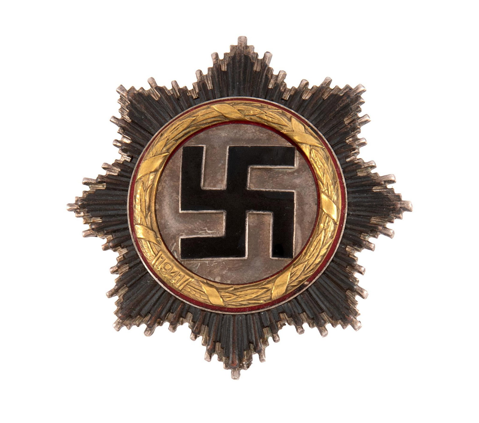 German World War II German Cross in Gold: Lot includes a German World War II German Cross in Golf. Measures 2 9/16'' wide by 2 9/16'' tall. The front shows a black enameled swastika in the center with an eight pointed star burst in the backgr