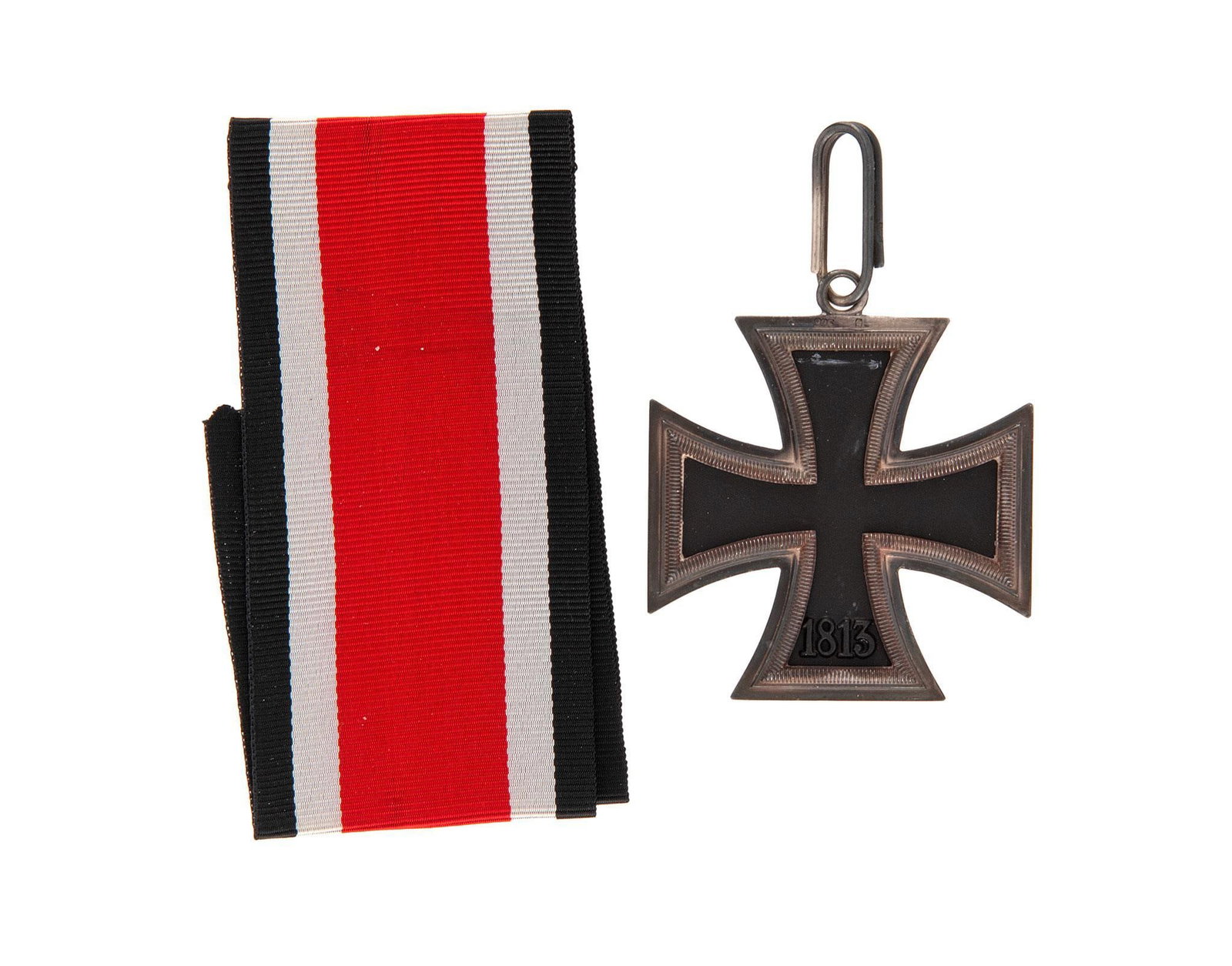 German WWII Knights Cross to the Iron Cross: Lot includes a German WWII Knights Cross to the Iron Cross. Measures 1 7/8'' wide by 2 1/16'' tall. The front has a tall swastika in the center of the maltese cross. It is dated '1939' on the lower ar