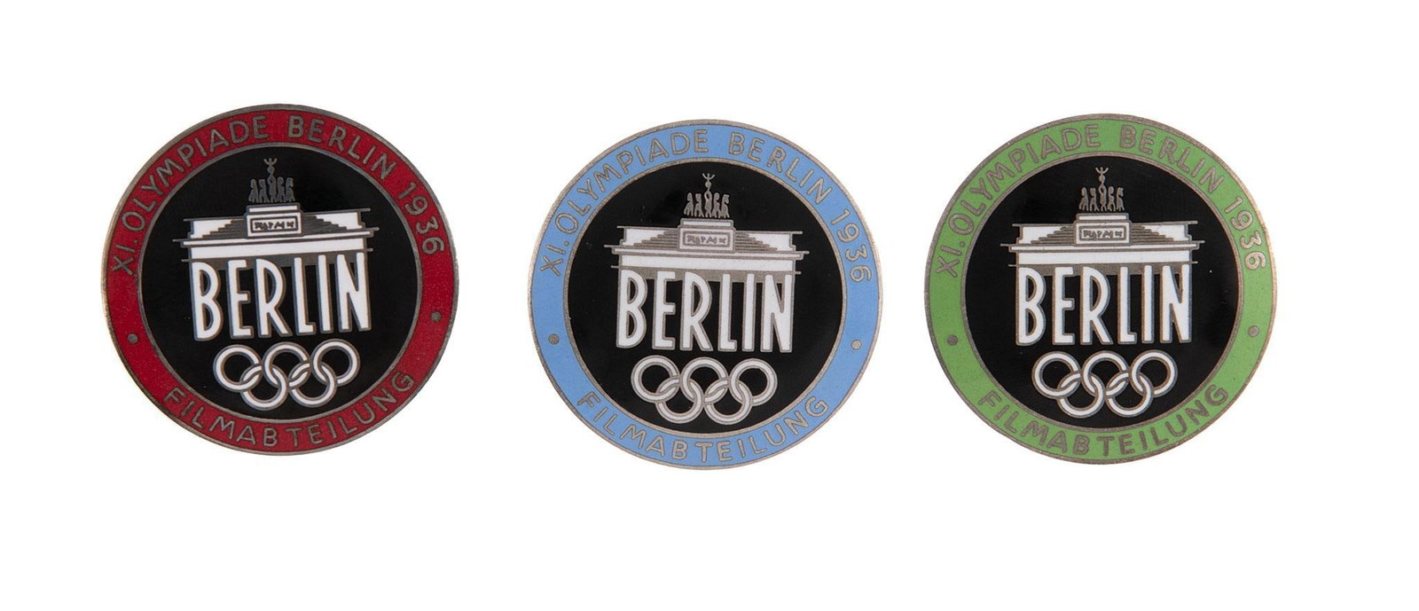 (3) German WWII 1936 Berlin Summer Olympics Film Maker Badges: (3) Lot includes a German WWII 1936 Berlin Summer Olympics Film Maker Badges. They Measure 1 1/2'' in diameter. The front reads 'XI. Olympiade Berlin 1936 Filmabteilung Berlin'. They show the Brandenb