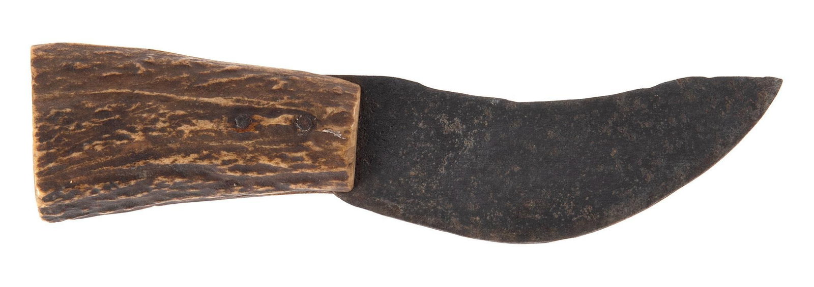 Primitive Stag Handled Skinning Knife: 4.25" curved blade with clip point, stag handle. The blade is held to the stag handle by two pins that have been pinned over. The blade has nice dark patina. An interesting primitive knife.