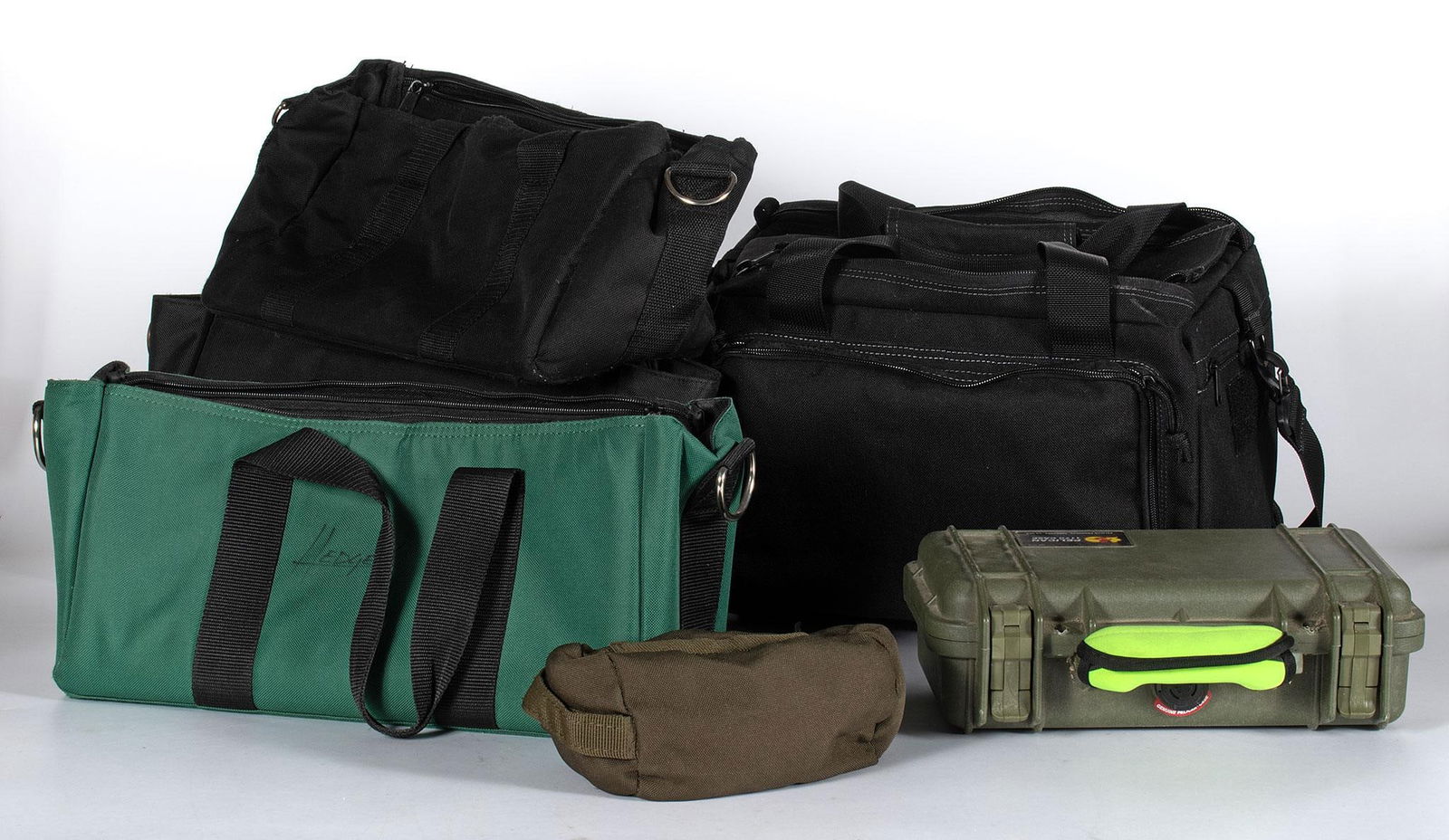 Large Lot of Canvas and Nylon Shooting bags: Lot includes a grouping 10 pistol and rifle shooting bags. Brands include Pelican, Midway, 5.11, Allen, and several unmarked. Overall good condition.