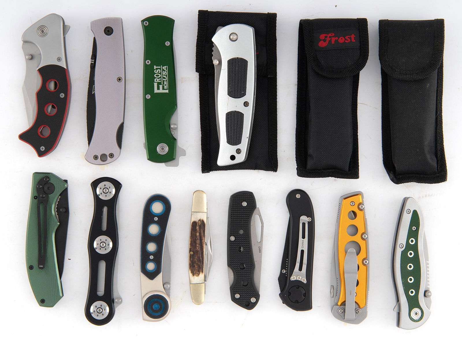 Group of Folding Pocket Knives: Lot includes 14 folding pocket knives by Frost Cutlery. Models include 16-466G(2), 16-471B, 16-179G, 16-464JD, 16-128BL, Flying Falcon (2), 16-100B, 16-940 SG, and SW 112DS, 16-011R, 15-775B,