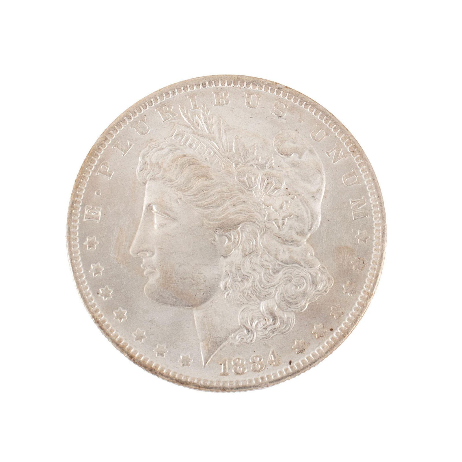 United States 1884-O Silver Morgan Dollar Coin: United States 1884-O silver Morgan dollar coin. Overall very high relief and very good condition minimal scratches. 27 grams.