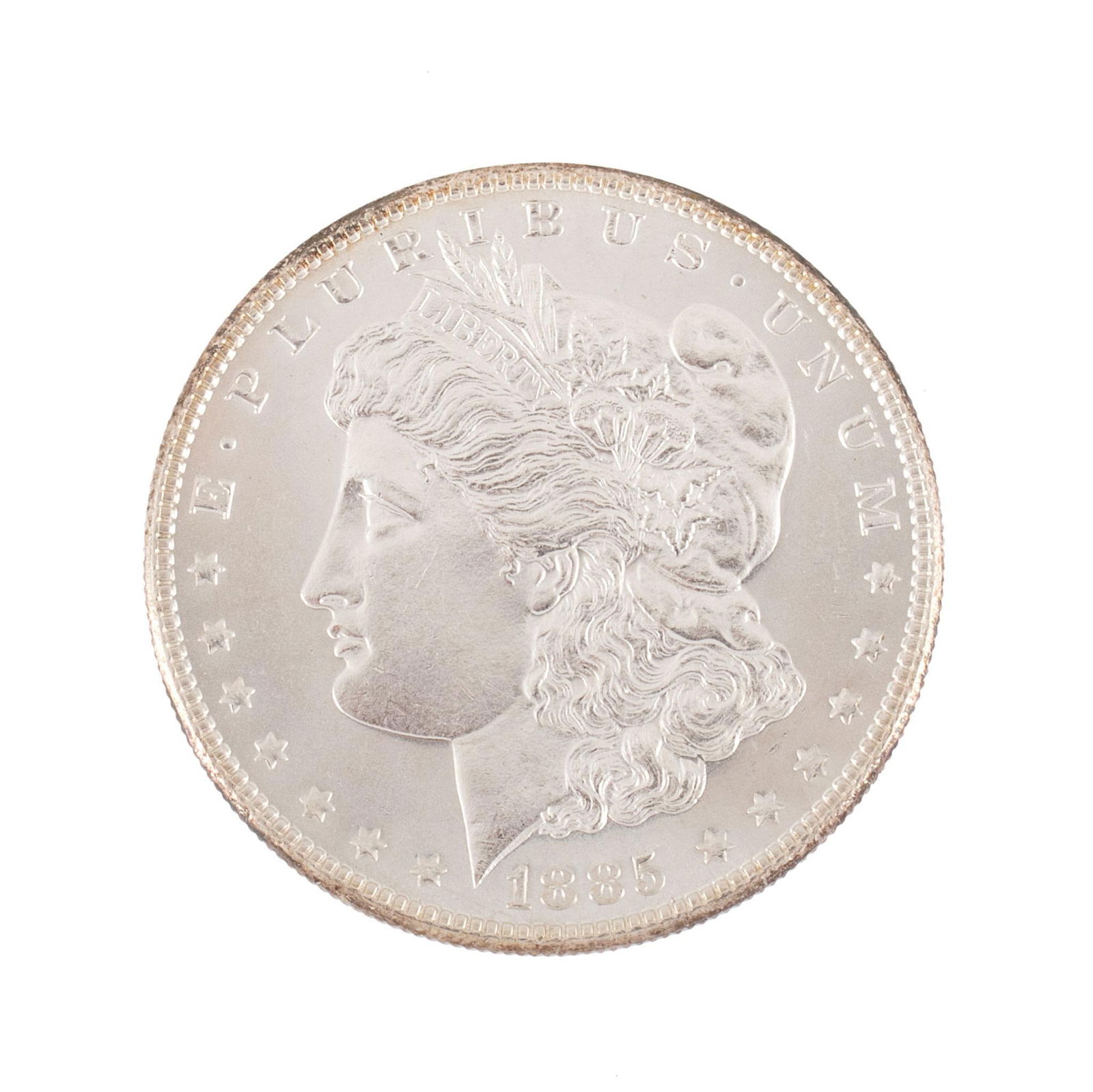 United States 1885 Silver Morgan Dollar Coin: United States 1885 silver Morgan dollar coin. Overall very high relief and very good condition. 27 grams.