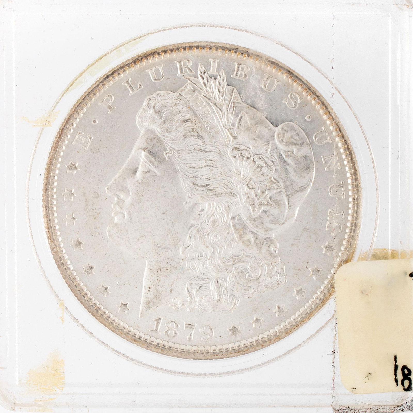 United States 1879 Silver Morgan Dollar Coin: A United States 1879-S silver Morgan dollar ungraded coin in case. Very good condition.