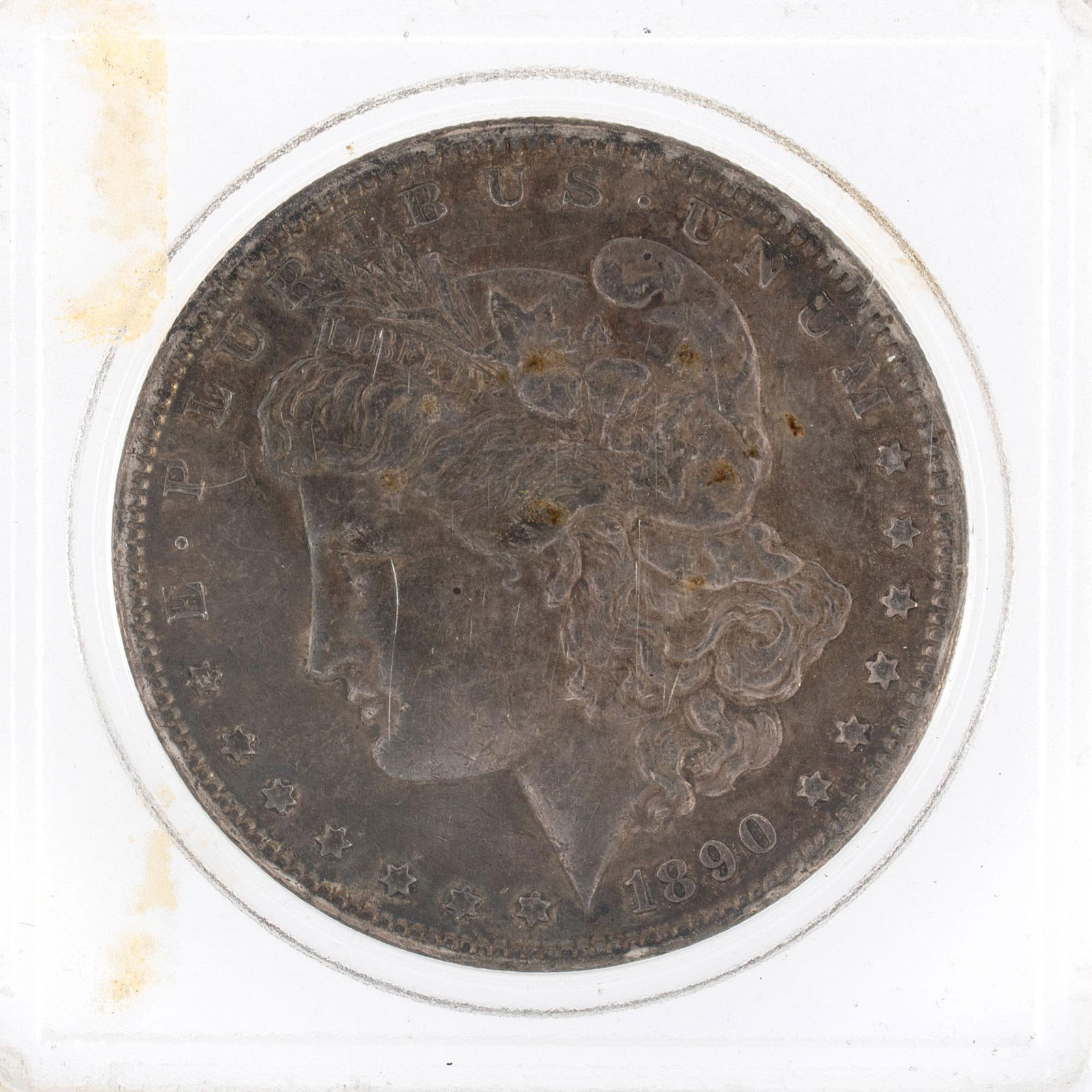United States 1890 Silver Morgan Dollar Coin: A United States 1890 silver Morgan dollar ungraded coin in case. Very good condition.