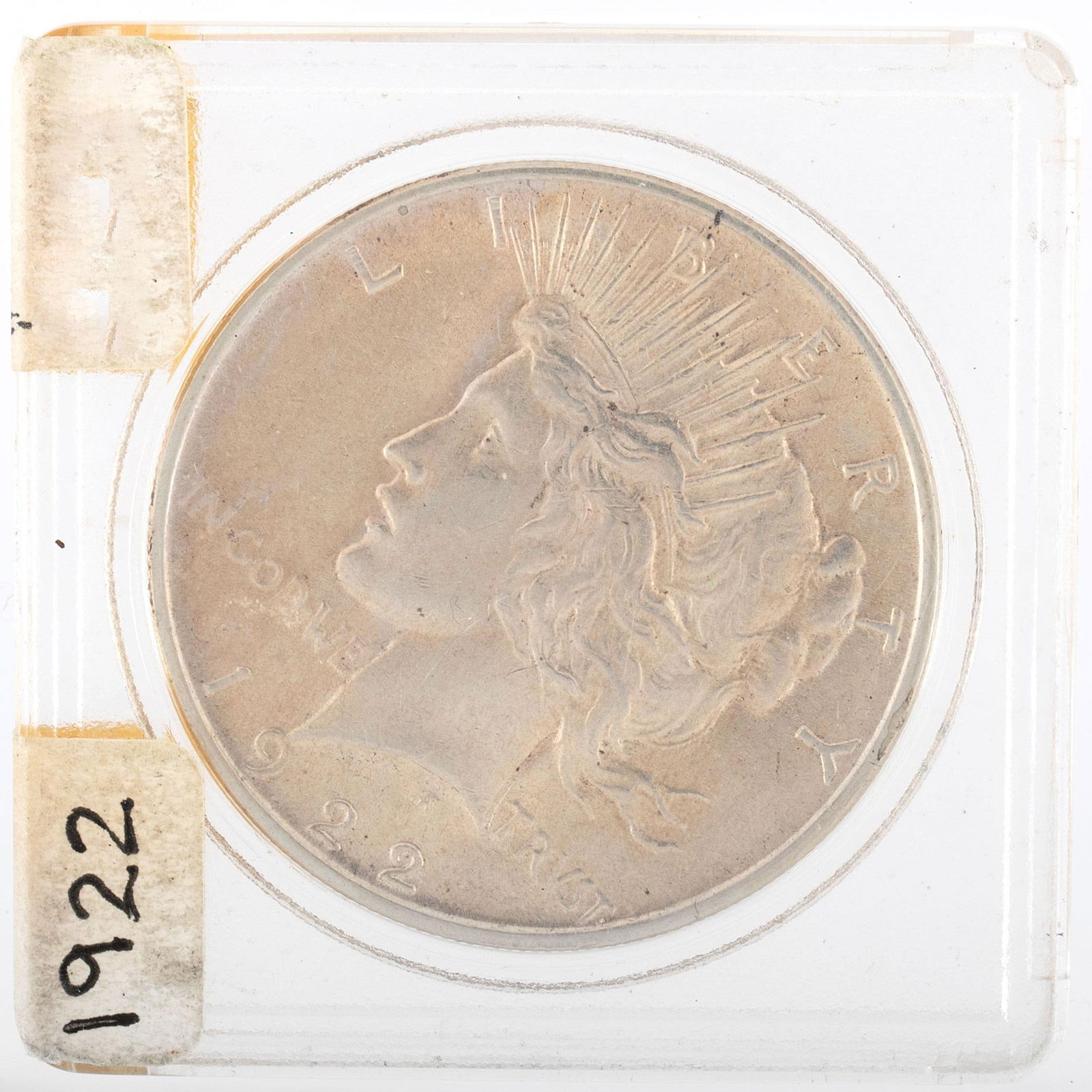 1922 United States Silver Peace Dollar Coin: A United States 1922 silver Peace dollar ungraded coin in case. Very good condition.
