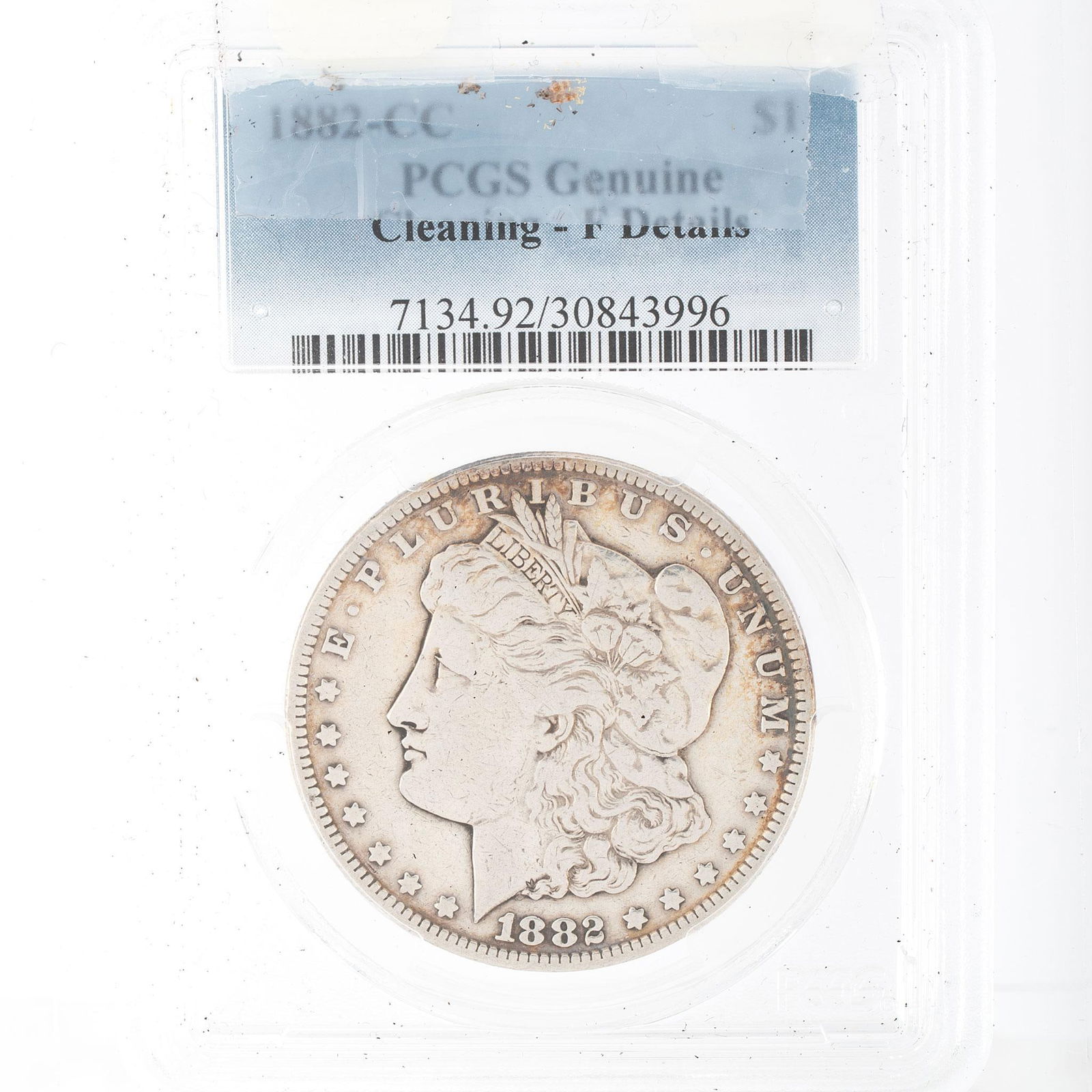 United States 1882 Carson City Silver Morgan Dollar Coin: A United States 1882-CC silver Morgan dollar with PCGS Genuie Cleaing F-Details in case.