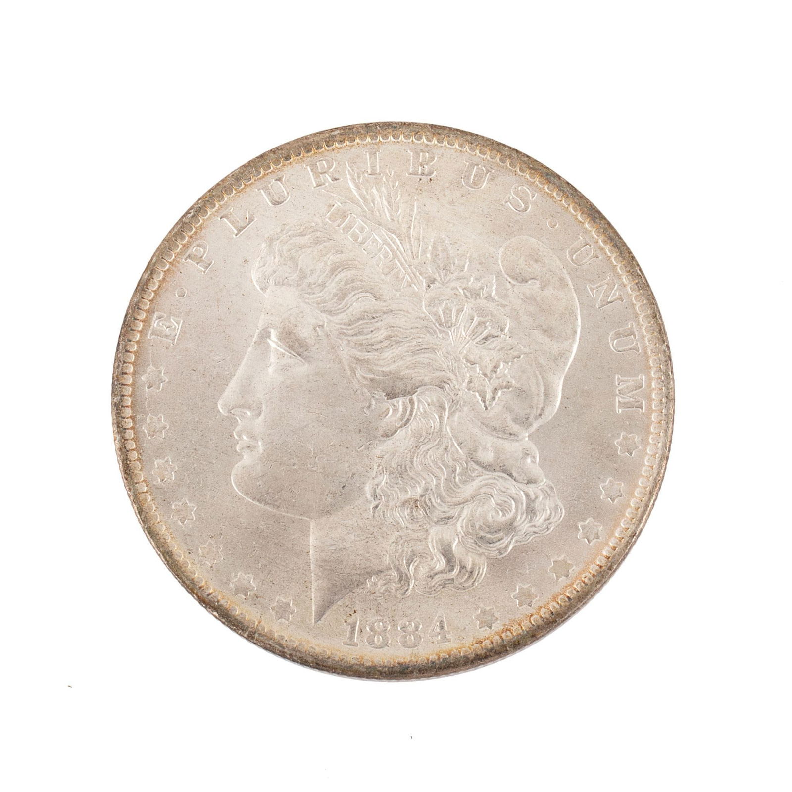 United States 1884-O Silver Morgan Dollar Coin: United States 1884-O silver Morgan dollar coin. Overall very high relief and very good condition minimal scratches. 27 grams.