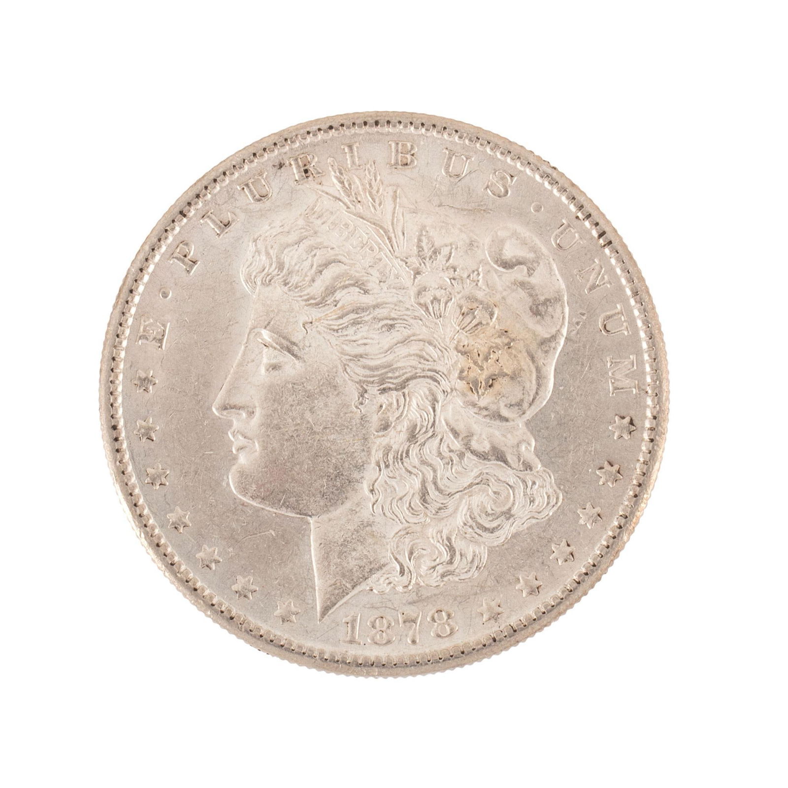 United States 1878-S Silver Morgan Dollar Coin: United States 1878-S silver Morgan dollar coin. Overall very high relief and very good condition minimal scratches. 27 grams.