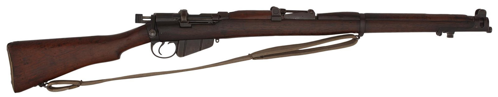 ** British Enfield 1916 Bolt Action Rifle: .303 caliber, 26" barrel, S/N 6046. Blue finish with walnut stock and handguard. A tropical web sling. Century Arms markings on the right side of the receiver. Overall very good. With a very good bore