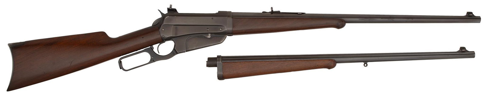 ** Winchester Model 1895 Takedown Lever Action Rifle: .405 W.C.F., 24" barrel, S/N 421985. Comes with extra barrel in 35 caliber, 24" length. Top of the frame is matted over the breech. Blue finish, walnut stock and forearm. Rear factory installed receiv