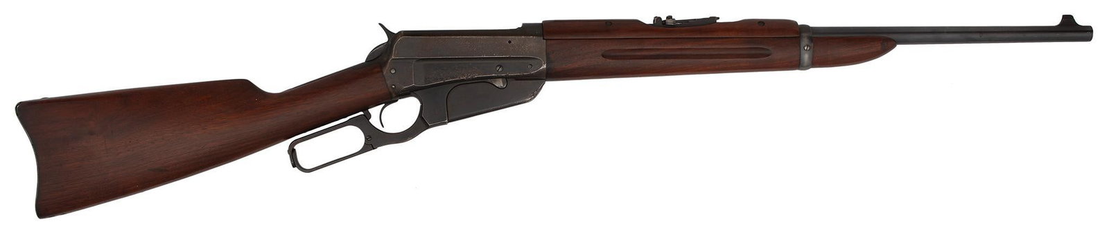 ** Winchester Model 1895 Lever Action Rifle: .30-40 Krag caliber, 22" barrel, S/N 424034. Military style rear barrel sight, blade front, blue finish, walnut stock and forearm with handguard. The barrel retains nearly all of the bright original