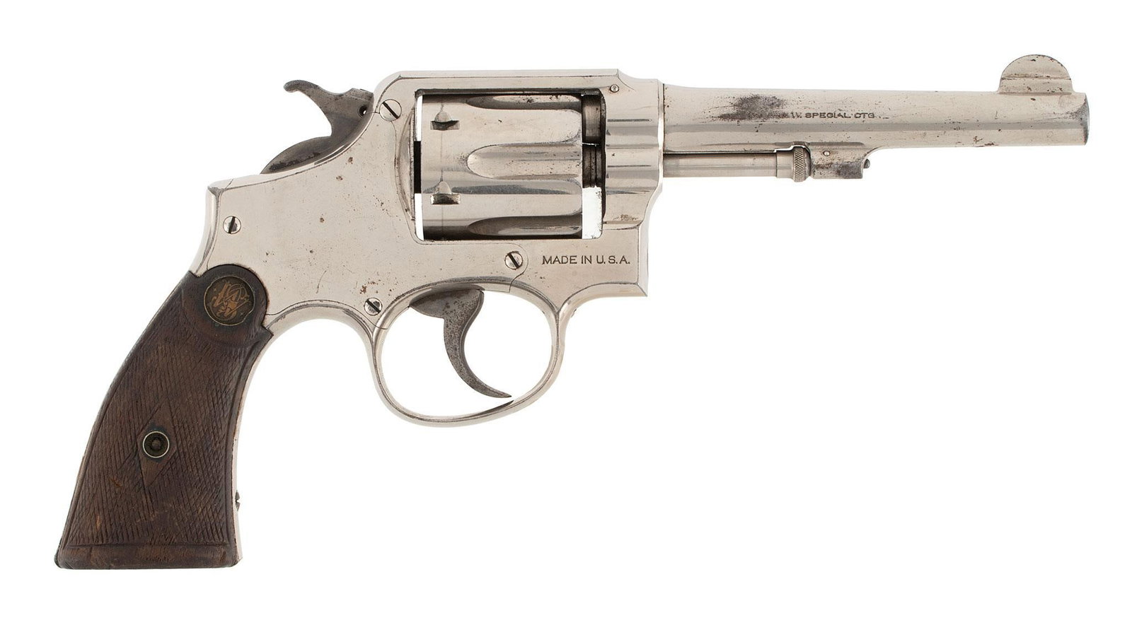 ** Smith and Wesson Model 1905 Revolver: .38 S&W Special caliber, 5" barrel length, S/N 439140. Left side of the barrel marked "Smith & Wesson". Left side of the frame with small S&W logo. Top of the barrel marked with 2 line add