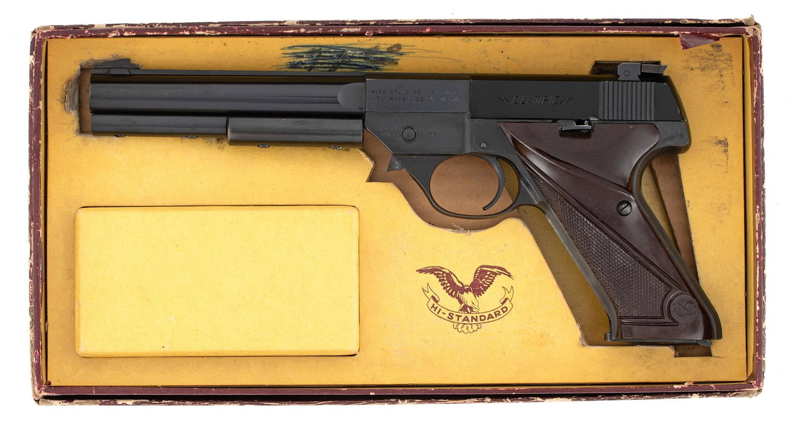 ** Hi-Standard Olympic Pistol: .22 short caliber, 6.5" barrel length, S/N 423498. Left side of the frame marked with 2 line address over caliber. Left side of the slide marked "Olympic." Front blade sight and rear notched sight.