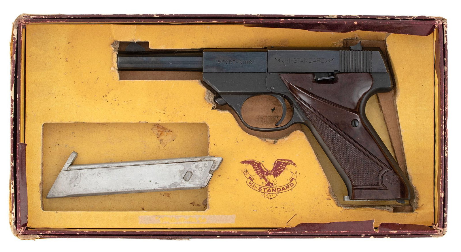 ** Hi-Standard SK-100 Pistol in Original Box: .22 long rifle caliber, 4.5" barrel length, S/N 542877. Left side of the frame marked "Sport King". Left side of the slide marked "Hi-Standard". Right side of the frame marked with 2 line address.
