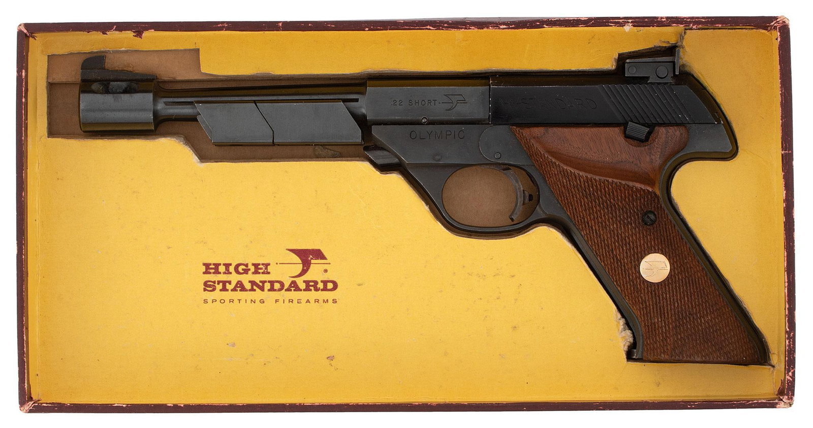 ** Hi-Standard Model 104 Olympic Pistol In Box: .22 short caliber, 6.75" barrel length, S/N 1864958. Left side of the frame marked "Hi - Standard" and "Olympic". Right side of the frame marked with model and 2 line address. Front target sight and r