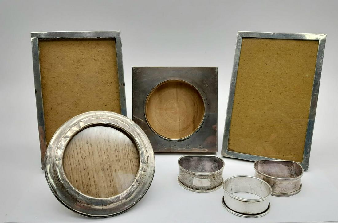A Mixed 925 Silver Lot to Include Three Silver Napkins Rings, and Four Wood and Silver Photo Frames.: A Mixed 925 Silver Lot to Include Three Silver Napkins Rings, and Four Wood and Silver Photo Frames.Vintage and Antique. 450g total weight. 14 x 10cm largest frame.