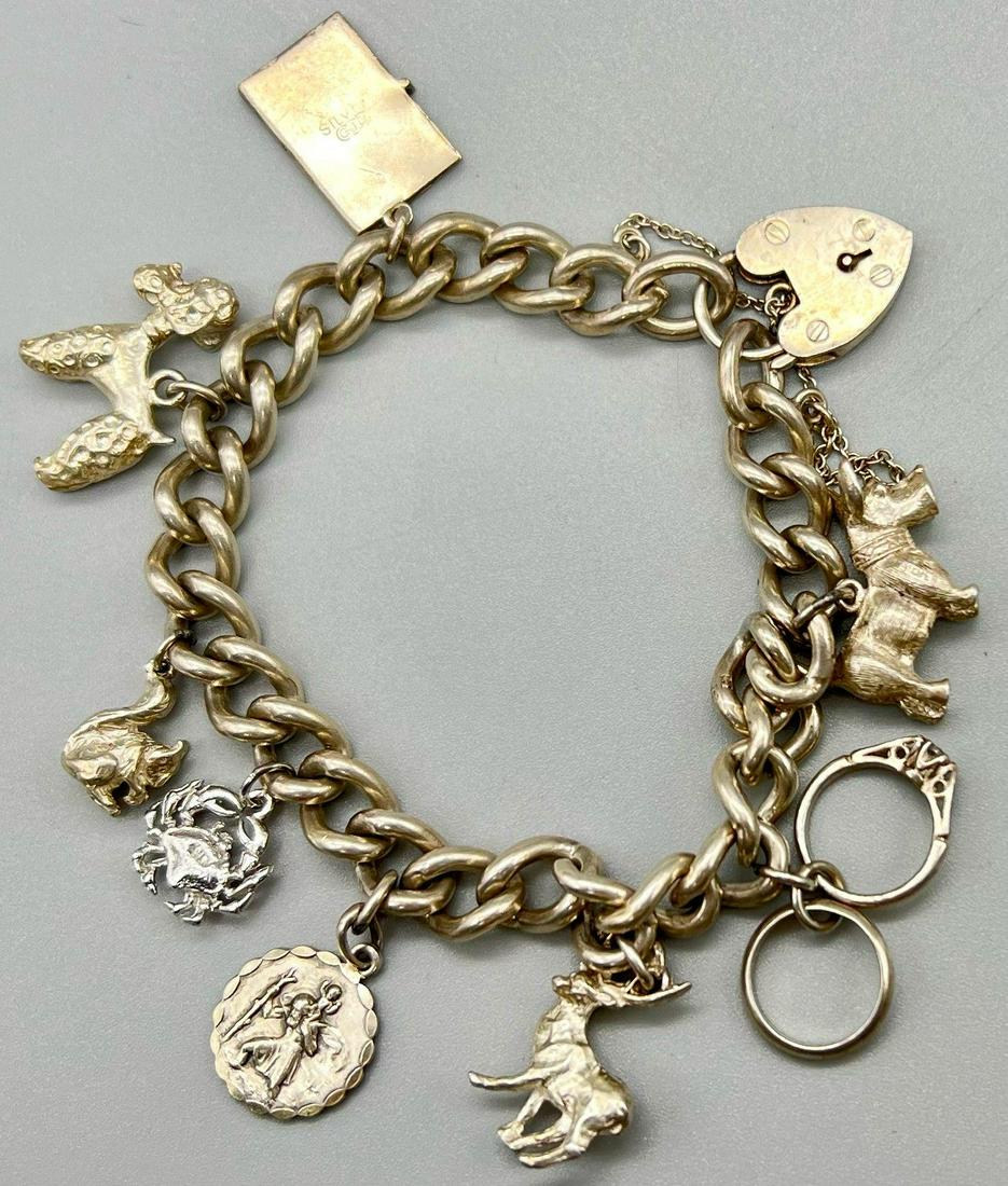 A Vintage 925 Silver Charm Bracelet with a Heart Clasp. 18cm. Total weight - 60g: A Vintage 925 Silver Charm Bracelet with a Heart Clasp. 18cm. Total weight - 60g