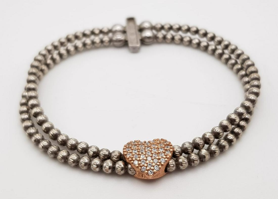STERLING SILVER STONE SET ELASTICTAED BRACELET 13.7G: STERLING SILVER STONE SET ELASTICTAED BRACELET 13.7G