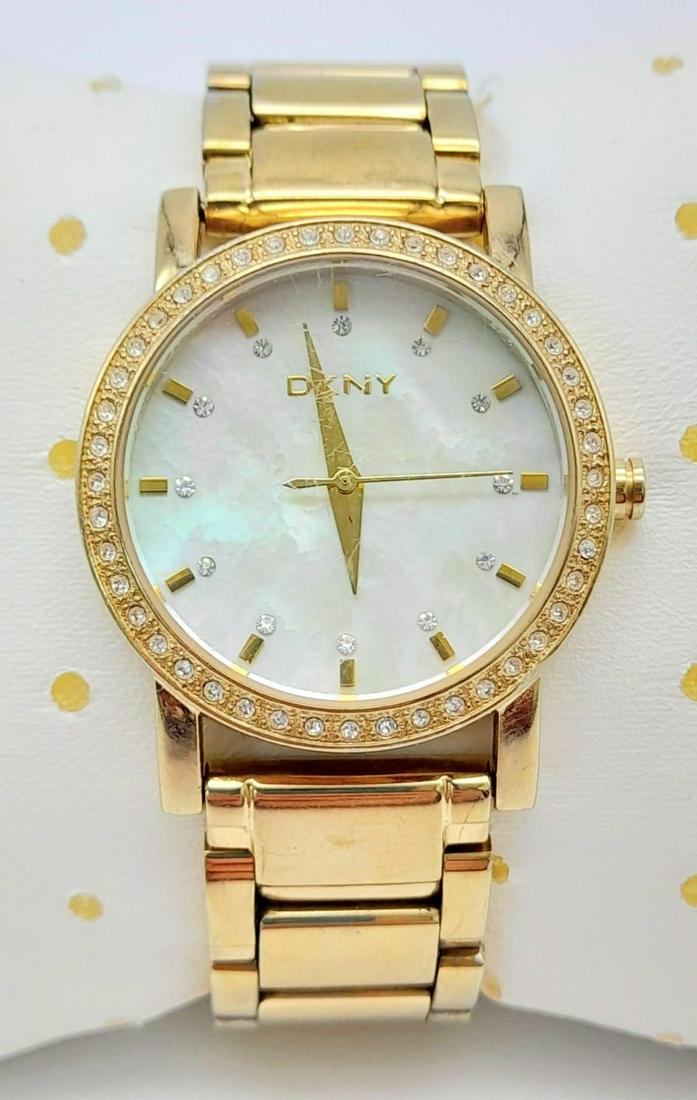 DKNY GOLD TONE BRACELET WATCH WITH STONE SETBEZEL, MOTHER OF PEARL DIAL, MODEL NY - 4792 AF: DKNY GOLD TONE BRACELET WATCH WITH STONE SETBEZEL, MOTHER OF PEARL DIAL, MODEL NY - 4792 AF