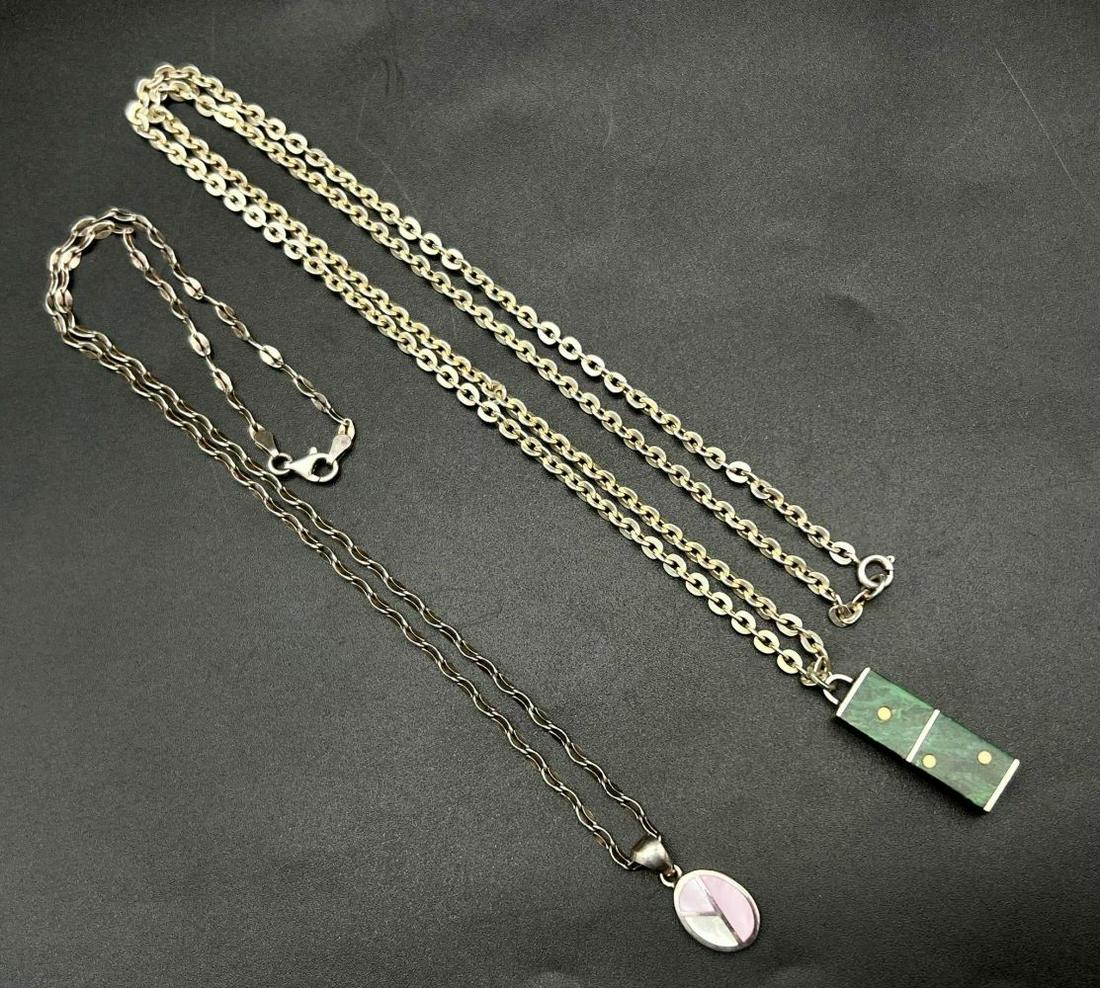 A Vintage 925 Silver and Malachite Dice Pendant - 3cm, on a white metal Chain and a mother of pearl: A Vintage 925 Silver and Malachite Dice Pendant - 3cm, on a white metal Chain and a mother of pearl pendant on a 925 silver necklace - 2cm and 44cm.