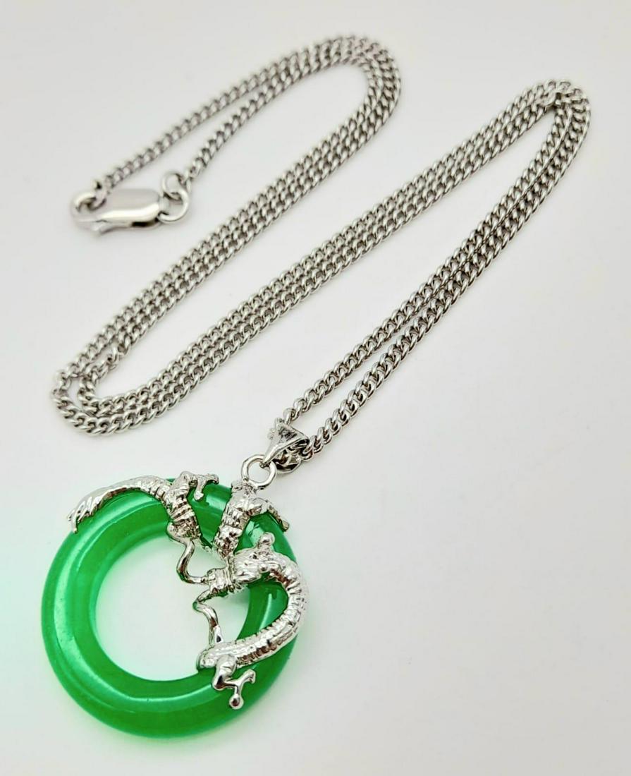 A Green Jade Circle Dragon Pendant on a 925 Silver Chain/ Necklace. 2.5cm and 46cm.: A Green Jade Circle Dragon Pendant on a 925 Silver Chain/ Necklace. 2.5cm and 46cm.