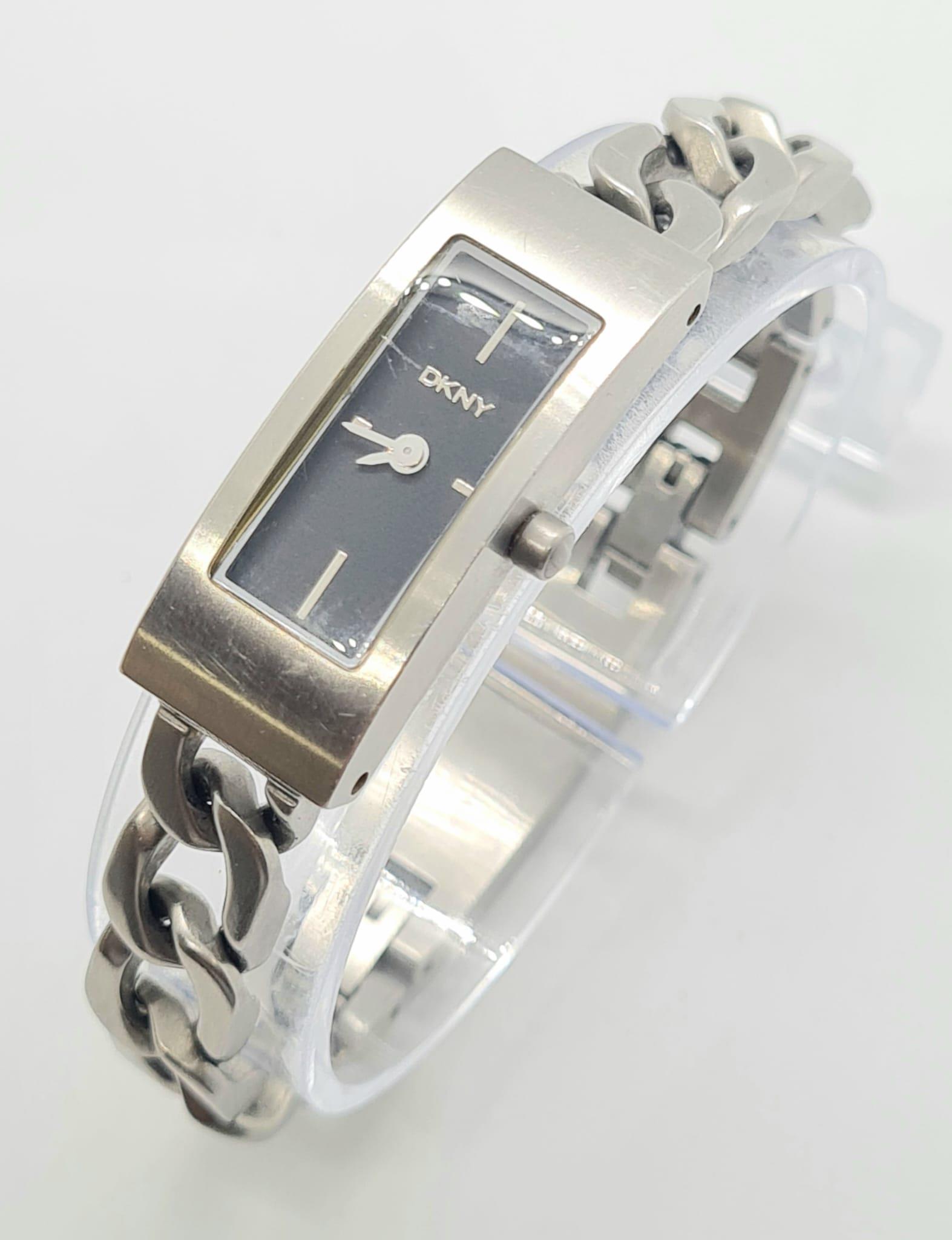 A DKNY Quartz Ladies Watch with Curb Link Bracelet. In working order.: A DKNY Quartz Ladies Watch with Curb Link Bracelet. In working order.