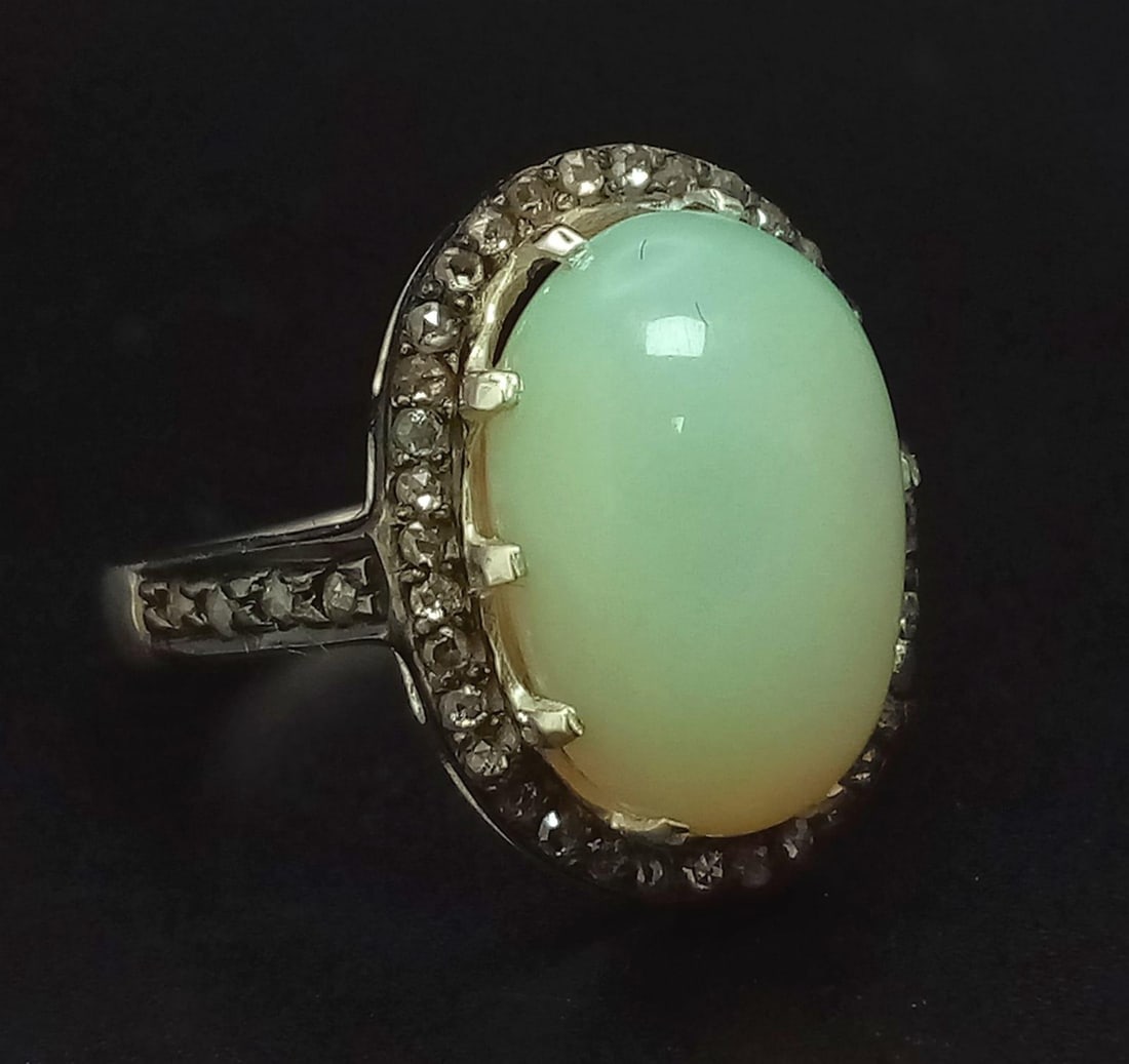 A Natural Ethiopian 4.06ct Opal Ring in 925 Silver with 0.35ct Diamonds Surround. Ring Size N1/2.: A Natural Ethiopian 4.06ct Opal Ring in 925 Silver with 0.35ct Diamonds Surround. Ring Size N1/2. AIG Milan Certified