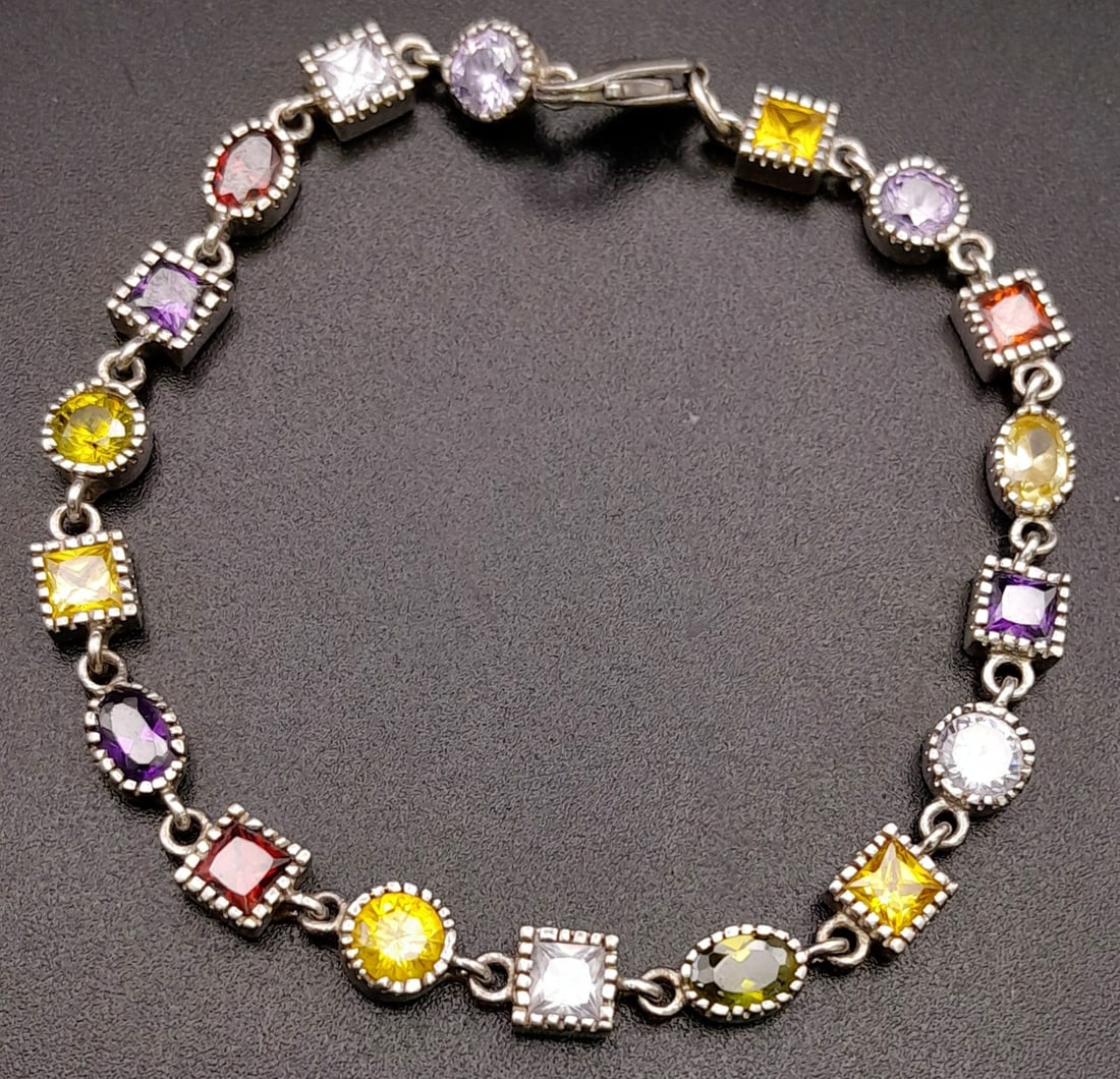 A Silver And Multi Stone Bracelet. Total Weight 11g. 19cm in length.: A Silver And Multi Stone Bracelet. Total Weight 11g. 19cm in length.