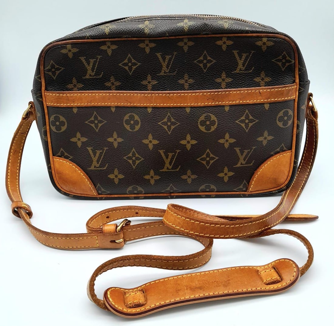 A Louis Vuitton Monogram Canvas Trocadero Bag. Brown leather trim and shoulder strap. Textile: A Louis Vuitton Monogram Canvas Trocadero Bag. Brown leather trim and shoulder strap. Textile interior with zipped pocket. 30cm x 19cm. In good condition but please see photos.
