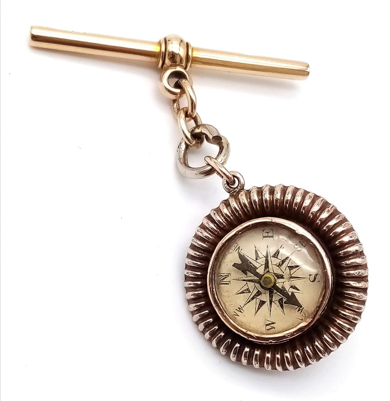 A 9K GOLD WATCH CHAIN FOB WITH ANTIQUE COMPASS AND DOGS HEAD REVERSE .10gms: A 9K GOLD WATCH CHAIN FOB WITH ANTIQUE COMPASS AND DOGS HEAD REVERSE .10gms