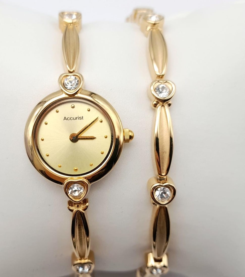 Ladies Gold Tone Accurist Stone Set Quartz Watch with Matching Bracelet. 19cm Length. In Excellent: Ladies Gold Tone Accurist Stone Set Quartz Watch with Matching Bracelet.19cm Length. In Excellent Condition and Full Working Order. New Battery Fitted August 2023. In Original Box with Paperwork.