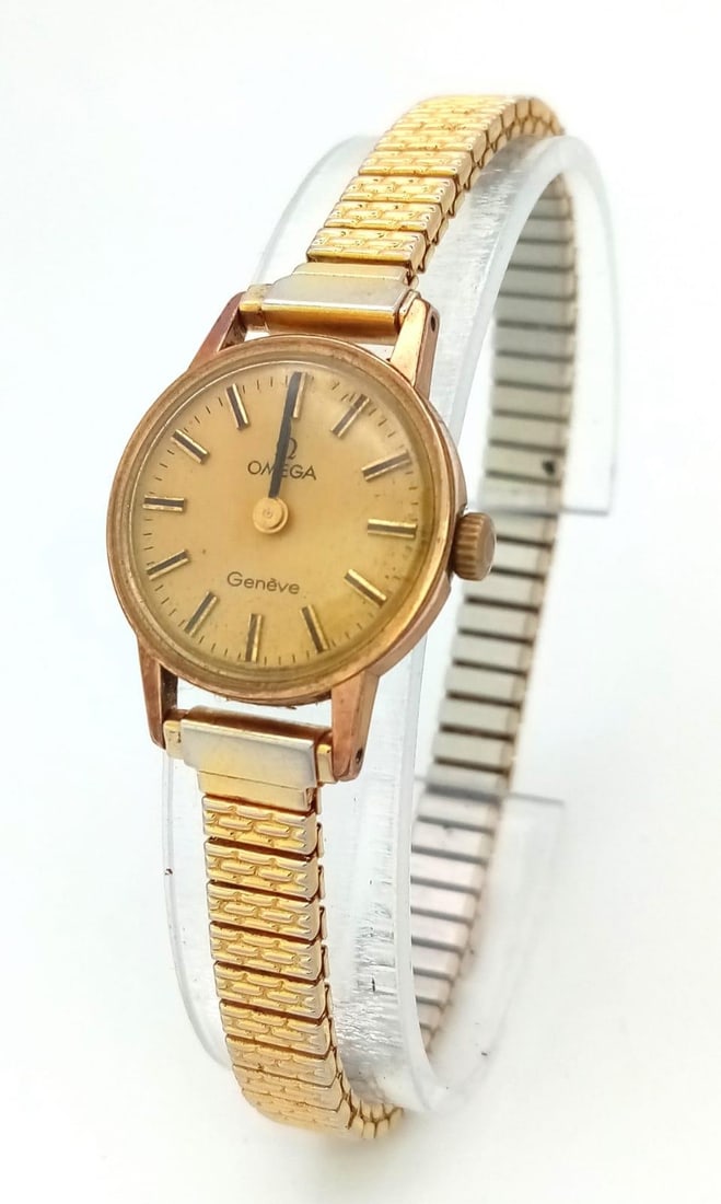 A Vintage Ladies Omega Geneve. Expandable gilded bracelet. Two tone case - 20mm. Gold tone dial.: A Vintage Ladies Omega Geneve. Expandable gilded bracelet.Two tone case - 20mm. Gold tone dial. Mechanical movement in working order.