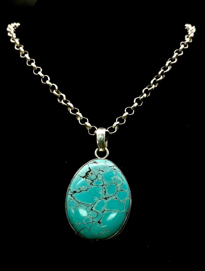 A Turquoise Pendant on 925 Silver and Chain. 68mm pendant and 46cm chain. 33.42g total weight.: A Turquoise Pendant on 925 Silver and Chain. 68mm pendant and 46cm chain. 33.42g total weight.