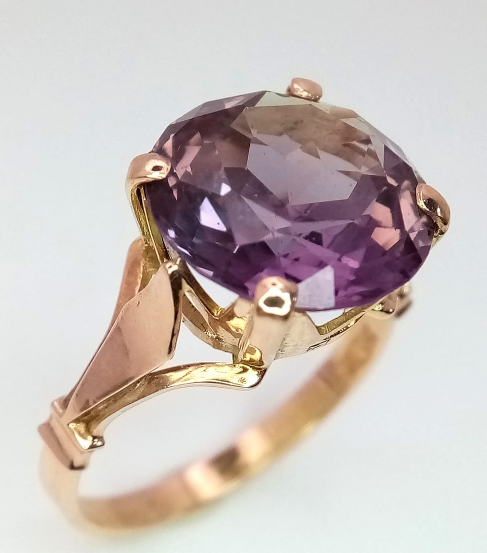 An Egyptian 12k Rose Gold Alexandrite Ring. A beautiful 7ct round cut alexandrite on a raised: An Egyptian 12k Rose Gold Alexandrite Ring. A beautiful 7ct round cut alexandrite on a raised foundation. Size R. 4.6g total weight.