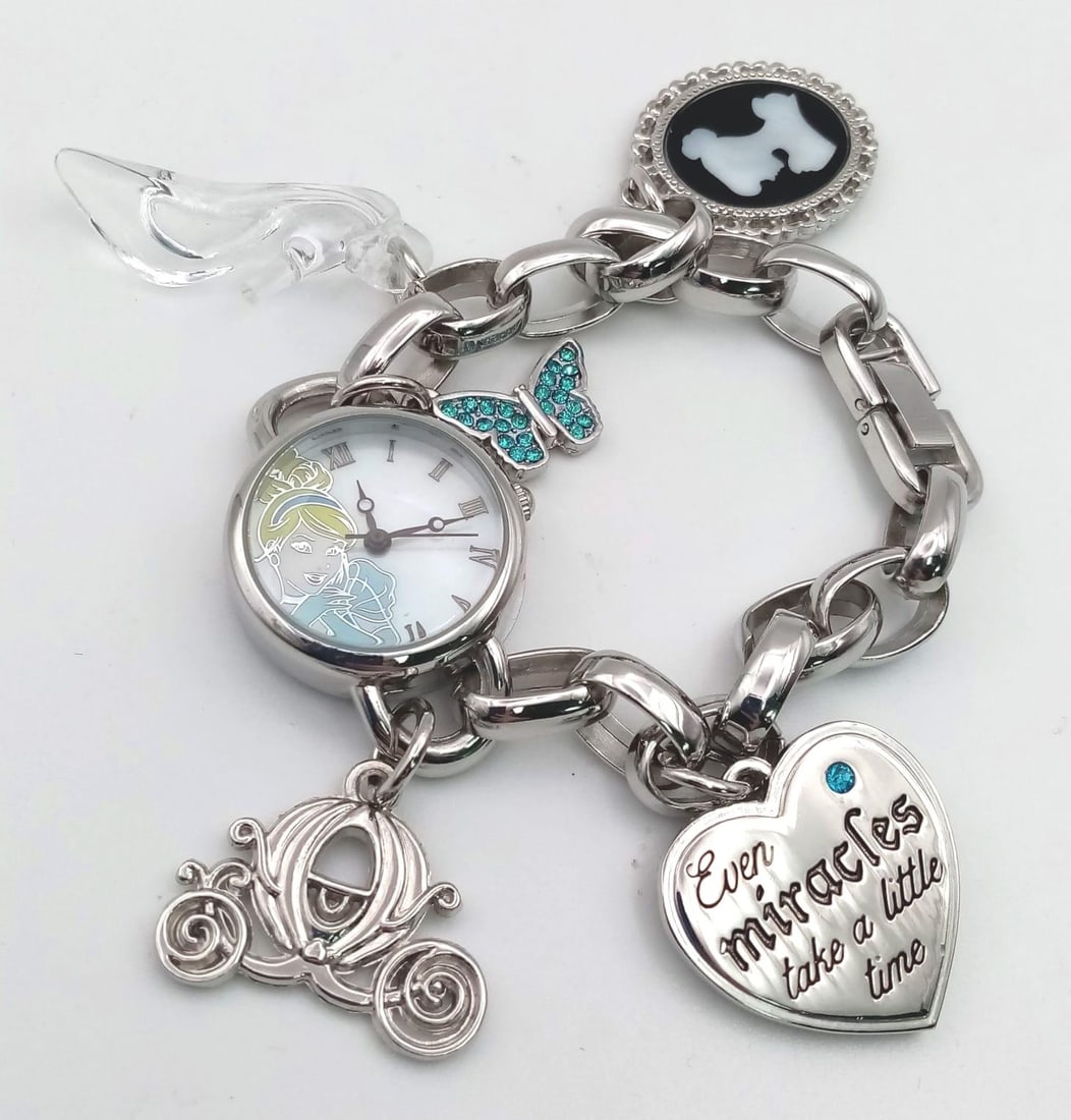 An Unworn Girls Disney Quartz Watch Charm Bracelet in its Presentation Box. Replacement Battery: An Unworn Girls Disney Quartz Watch Charm Bracelet in its Presentation Box. Replacement Battery Fitted November 2023. Full working order.