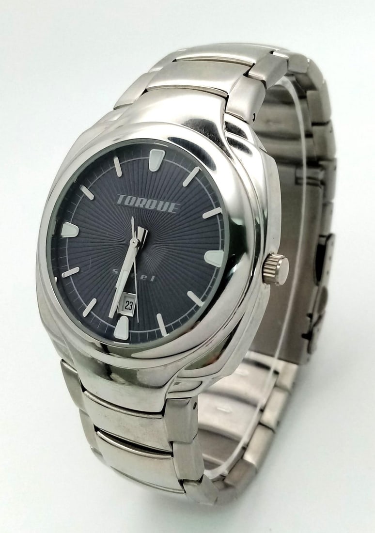 An Unworn Ex Display Men s Stainless Steel Date Watch by Torque. Replacement Battery Fitted October: An Unworn Ex Display Men s Stainless Steel Date Watch by Torque.Replacement Battery Fitted October 23. Comes with Box and Papers.