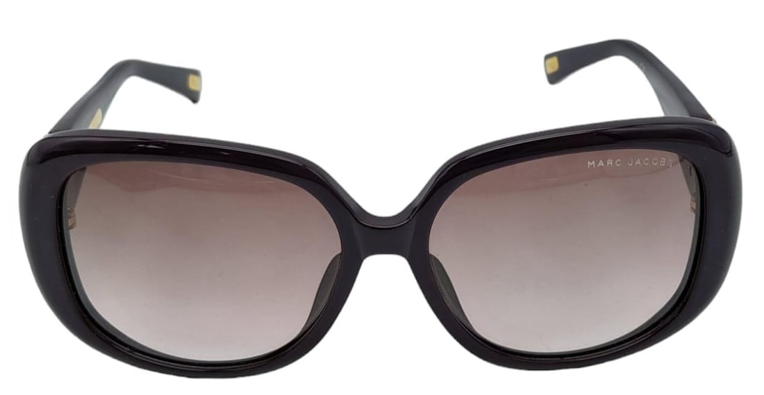 Beautiful pair of Marc Jacobs Purple Sunglasses. Made in Italy. Big bold frame with funky gemmed: Beautiful pair of Marc Jacobs Purple Sunglasses.Made in Italy. Big bold frame with funky gemmed love heart accents, this pair is sure to turn some heads. Measure 15cm wide. Come with case. See photos