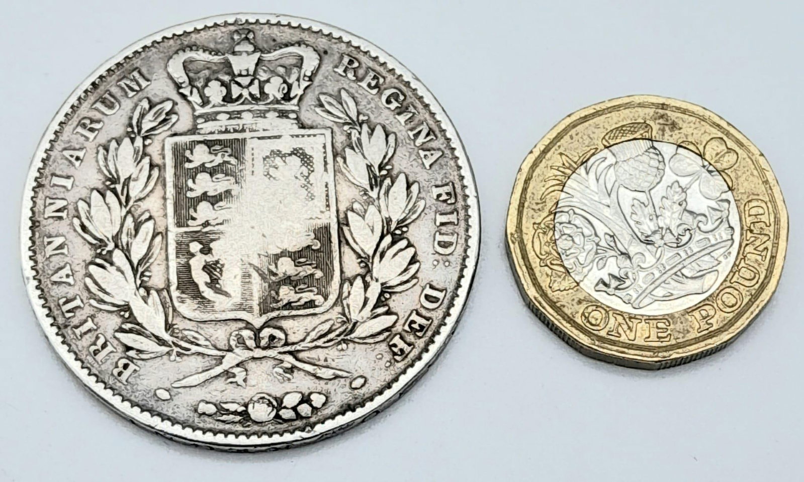 An 1845 Queen Victoria Young Head Crown. VF+ grade outside of middle upper right shield - but please: An 1845 Queen Victoria Young Head Crown. VF+ grade outside of middle upper right shield - but please see photos.