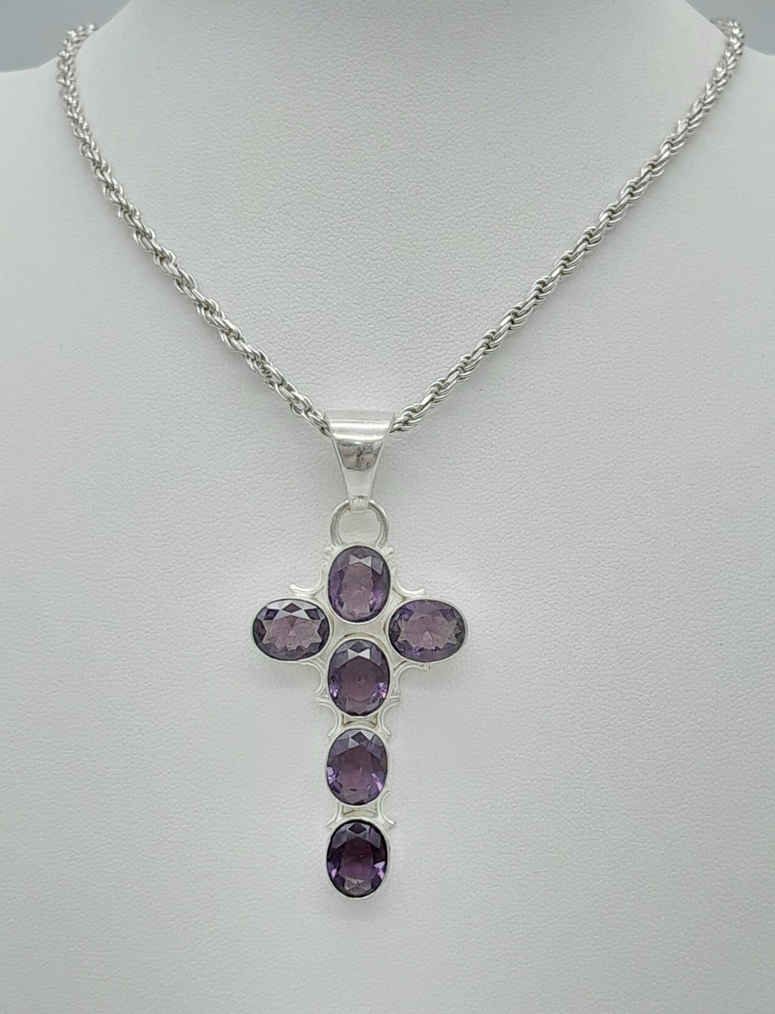 An Amethyst Cross Silver Pendant on a 925 Silver Chain. 50cm and 6cm.: An Amethyst Cross Silver Pendant on a 925 Silver Chain. 50cm and 6cm.