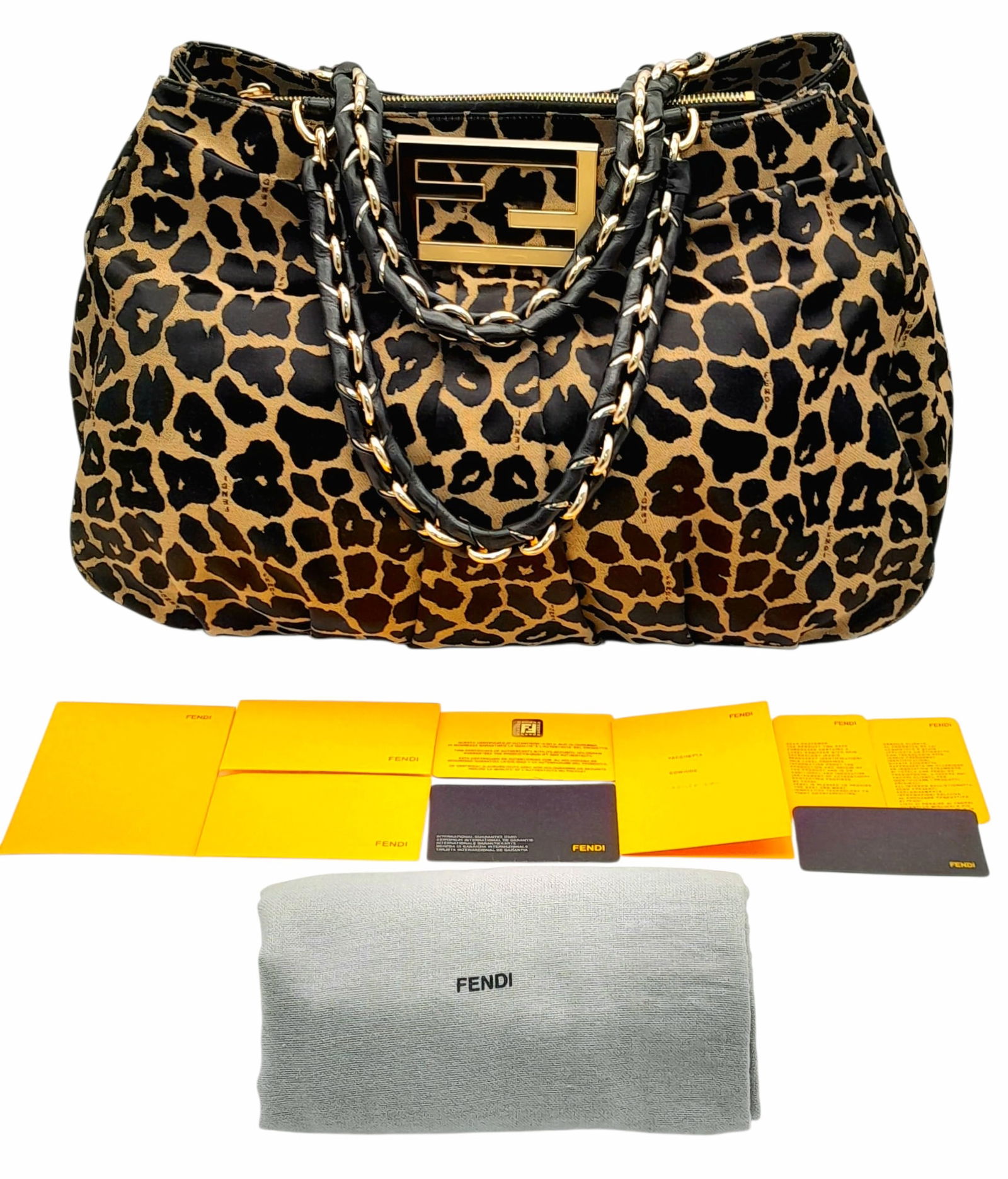 A Fendi Leopard-Print Fabric Shoulder Bag. Black leopard-print fabric exterior with gold-toned: A Fendi Leopard-Print Fabric Shoulder Bag. Black leopard-print fabric exterior with gold-toned hardware and dual top handles. Black textile interior with a central zipped compartment dividing two open